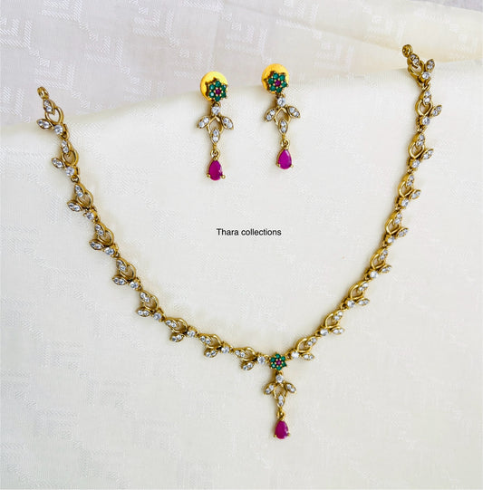 Elegant Gold-Toned Necklace Set with Ruby & Emerald Accents